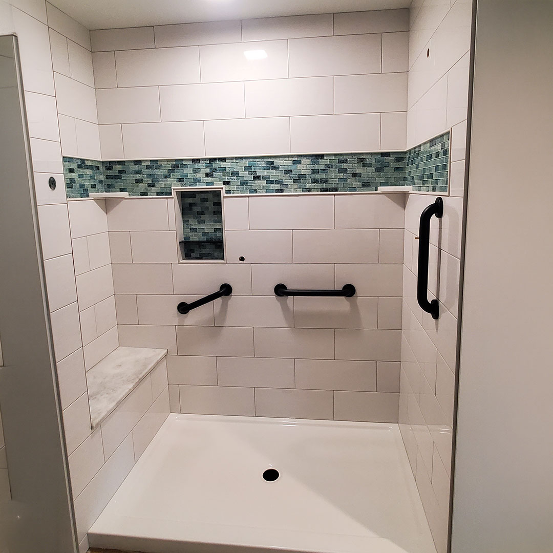 Tile shower with bench and shelving in Ashland, Ohio